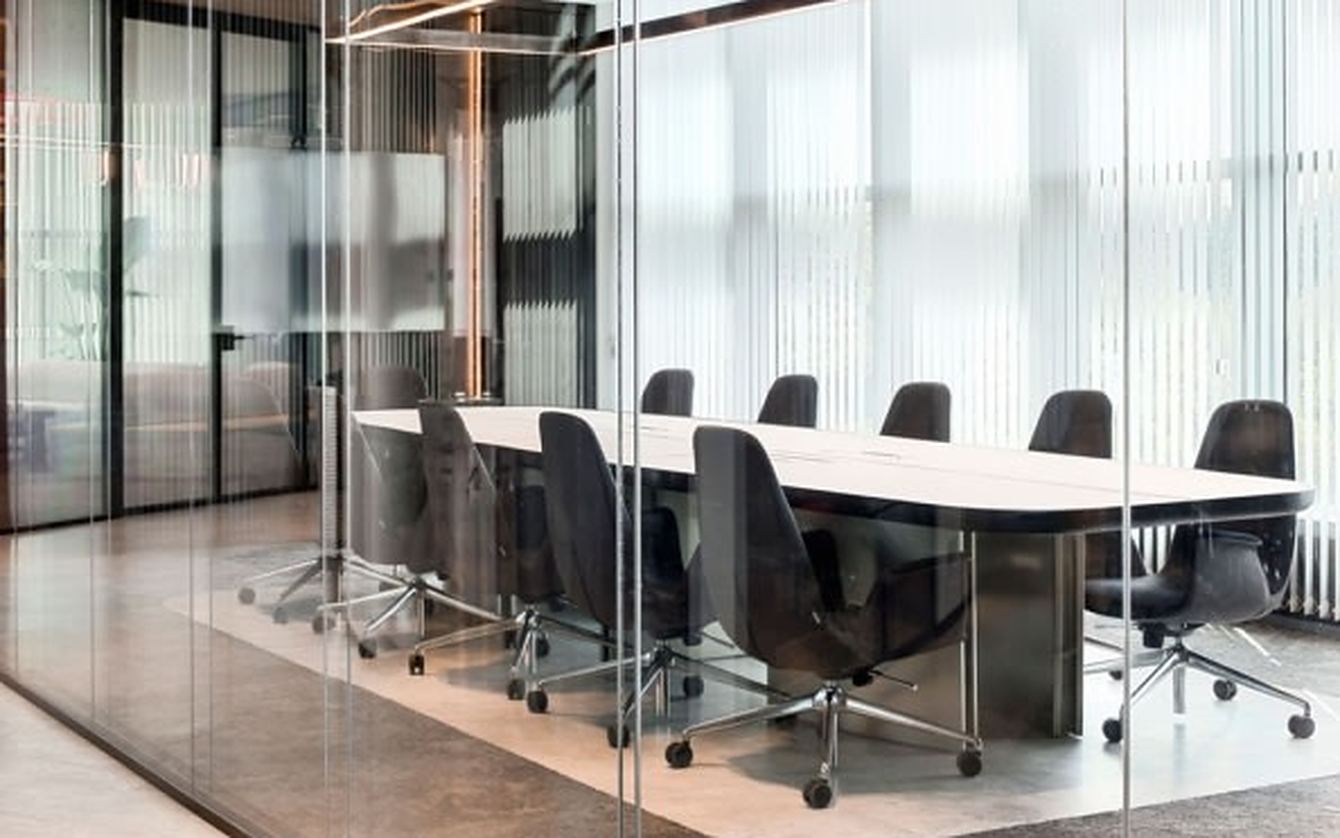 Glass-walled conference room for website planning sessions